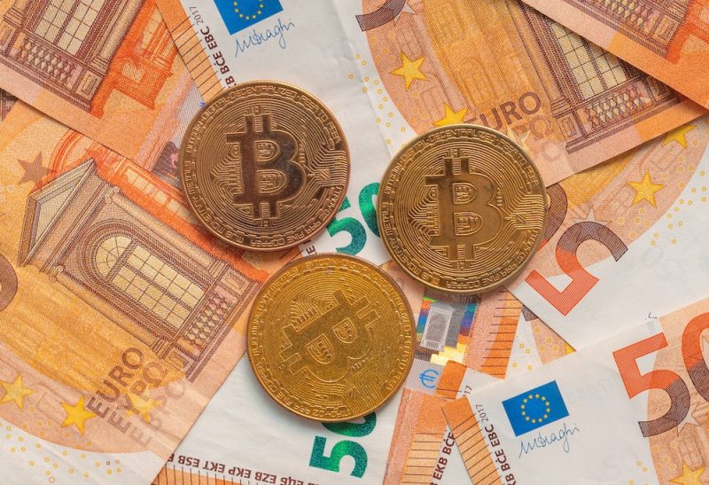 bitcoin-coins-and-euro-banknotes-2023-11-27-04-58-52-.jpeg