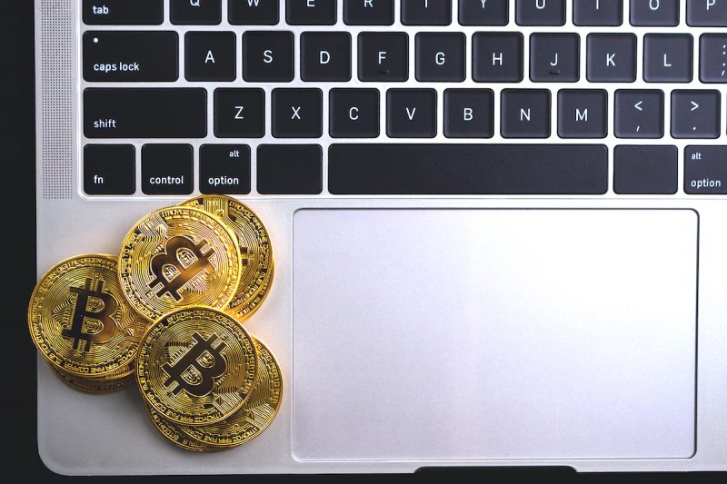 golden-coins-with-bitcoin-symbol-on-computer-2022-12-16-03-07-43-utc.jpg