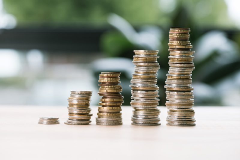 selective-focus-of-low-and-high-stacks-of-coins-on-2023-11-27-05-13-38-utc.jpeg